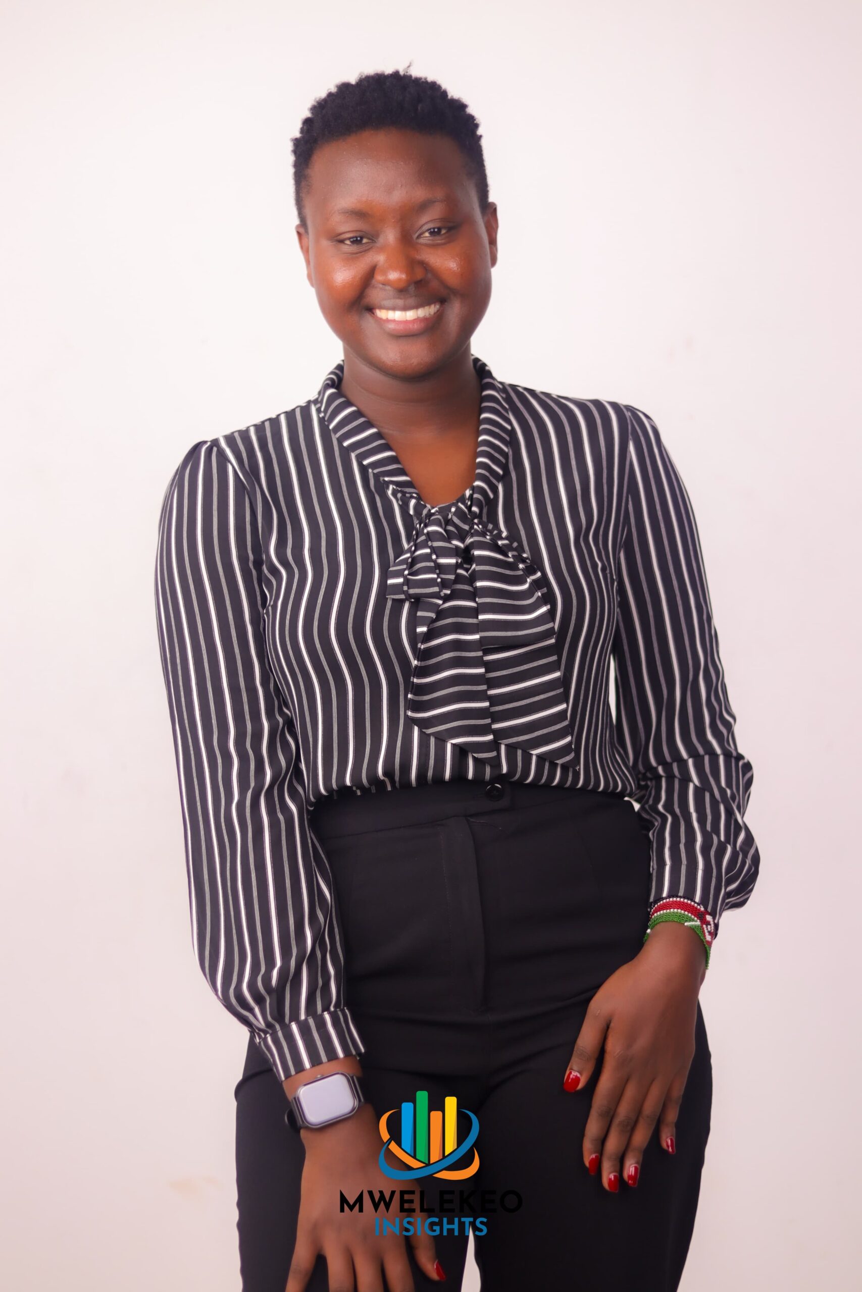 Mwelekeo Insights’ TV host and data analyst Fridah Mong’are smiles during a photo session. Photo: Mwelekeo Insights