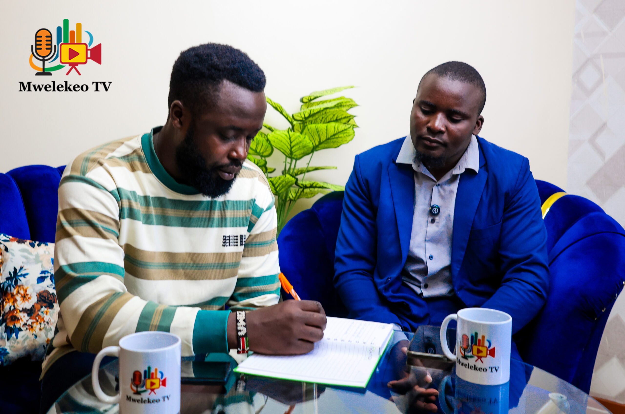 Mwelekeo TV host Kevin Waswa speaks to bodaboda rider Phineas. Photo/Mwelekeo TV